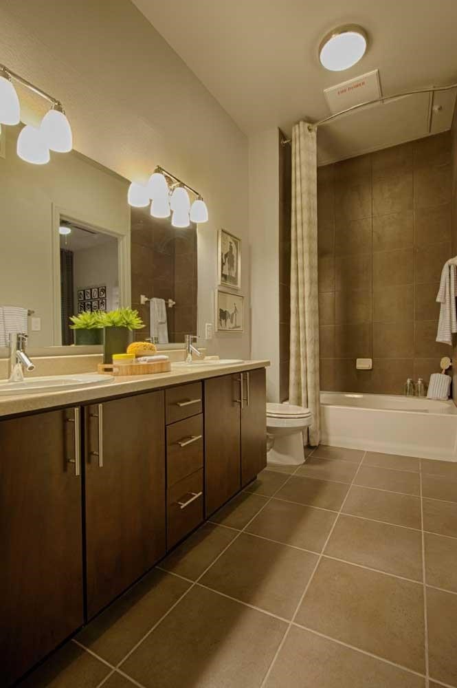 2525 McCue Road, Unit 535 Houston, TX 77056 - Photo 9 of 16 a bathroom with a double vanity sink a mirror and a shower