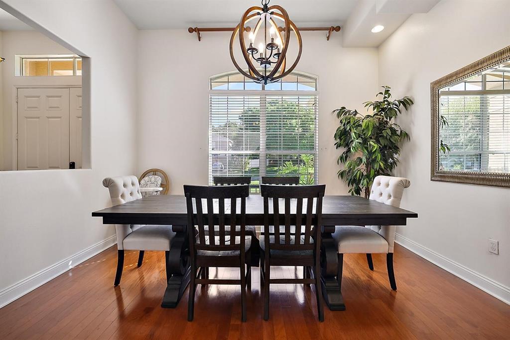 2847 Majestic Isle Drive Clermont, FL 34711 - Photo 11 of 25 a view of a dining room with furniture window and wooden floor