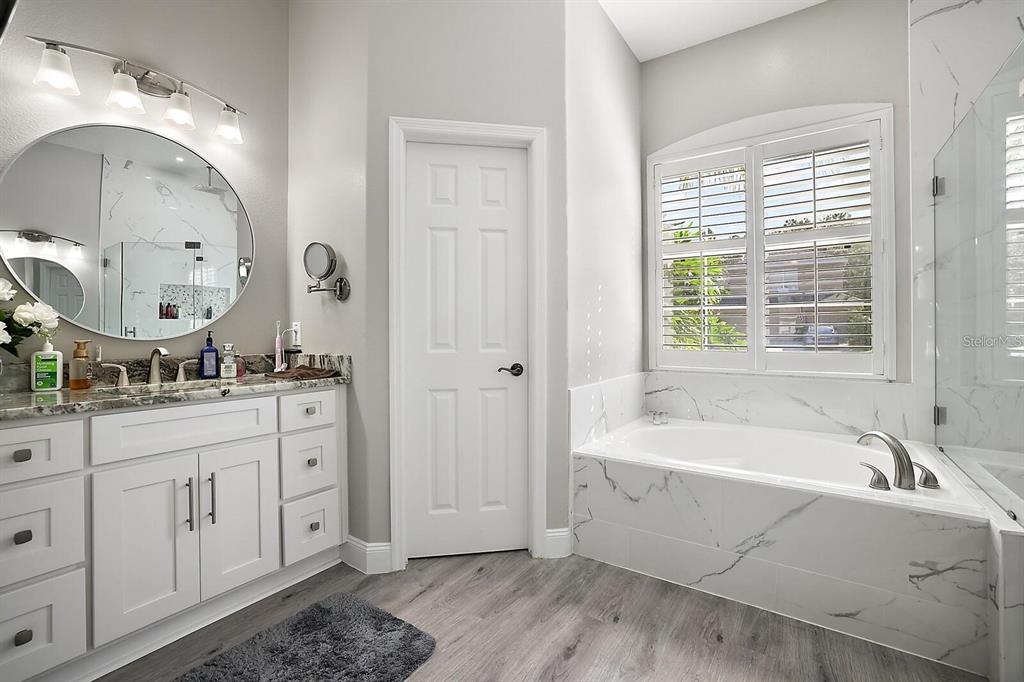 2847 Majestic Isle Drive Clermont, FL 34711 - Photo 13 of 25 a spacious bathroom with sink shower and bathtub