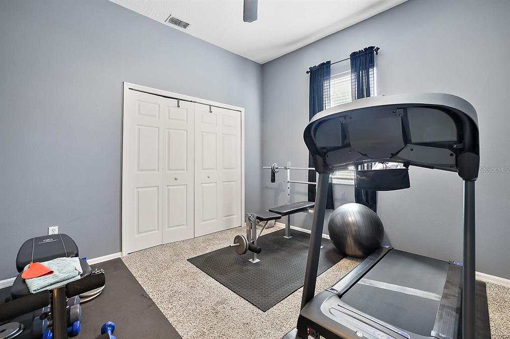 2847 Majestic Isle Drive Clermont, FL 34711 - Photo 18 of 25 a room with gym equipment