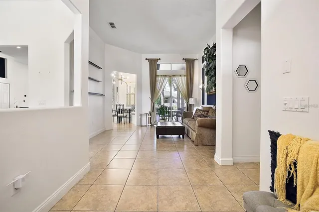 a lobby with furniture and a rug