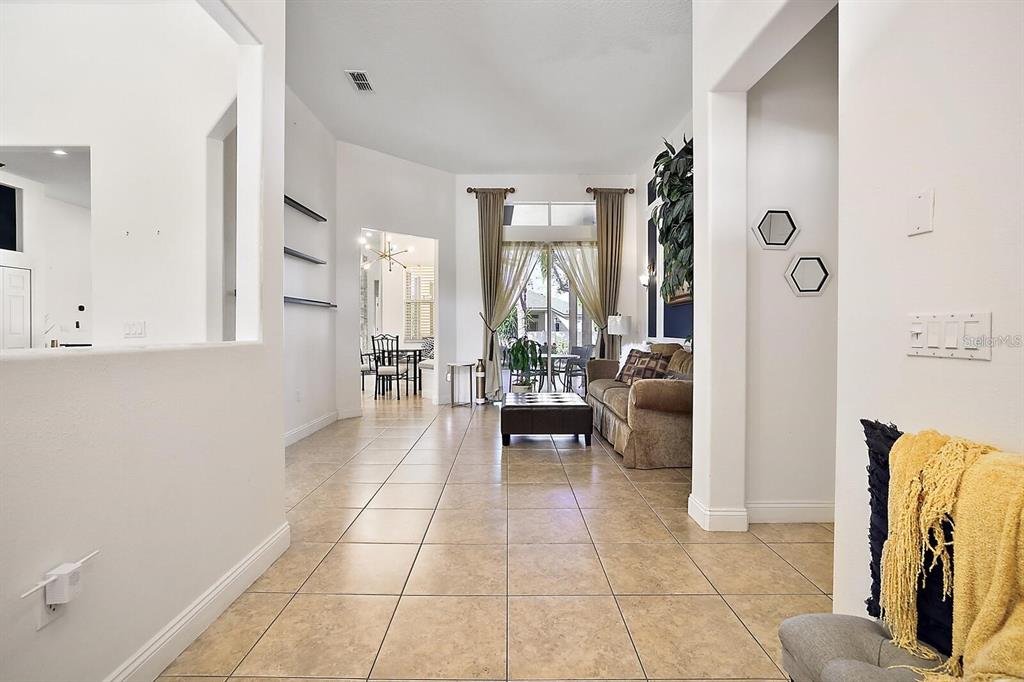 2847 Majestic Isle Drive Clermont, FL 34711 - Photo 2 of 25 a lobby with furniture and a rug