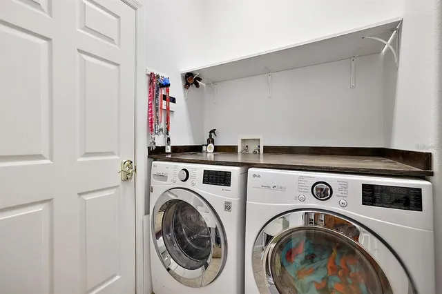 a utility room with dryer and washer