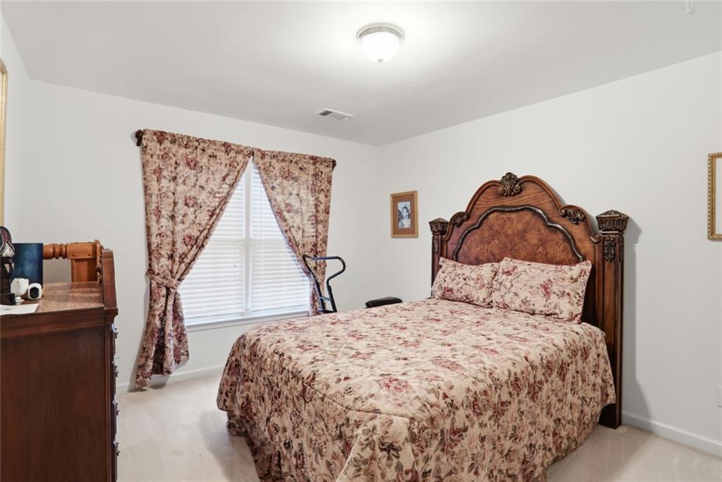 632 Grande View Stone Mountain, GA 30087 - Photo 17 of 46 a bedroom with a bed and a window