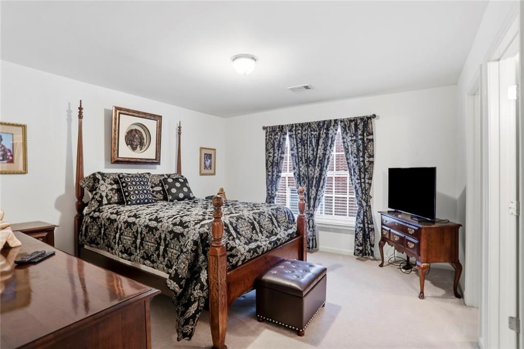 632 Grande View Stone Mountain, GA 30087 - Photo 21 of 46 a bed room with furniture and a flat screen tv