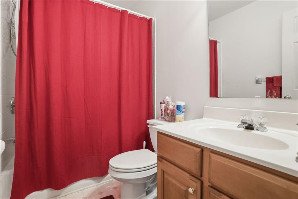 632 Grande View Stone Mountain, GA 30087 - Photo 23 of 46 a bathroom with a sink a toilet and shower