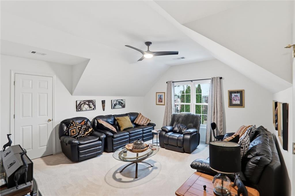632 Grande View Stone Mountain, GA 30087 - Photo 25 of 46 a living room with furniture a couch and a window
