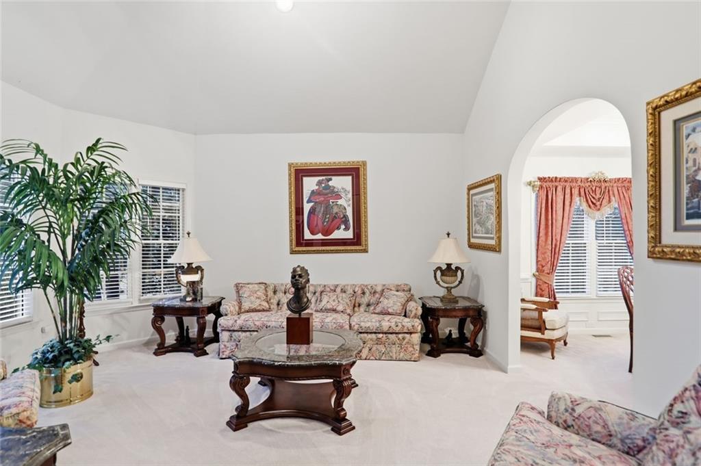 632 Grande View Stone Mountain, GA 30087 - Photo 3 of 46 a living room with furniture and a potted plant