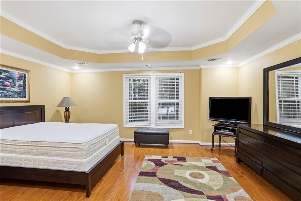 632 Grande View Stone Mountain, GA 30087 - Photo 32 of 46 a bedroom with a bed and a flat screen tv
