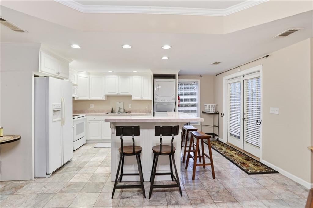 632 Grande View Stone Mountain, GA 30087 - Photo 38 of 46 a kitchen with a table and chairs in it