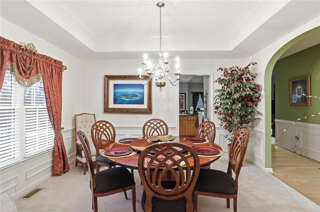 632 Grande View Stone Mountain, GA 30087 - Photo 5 of 46 a dining room with furniture a chandelier and window