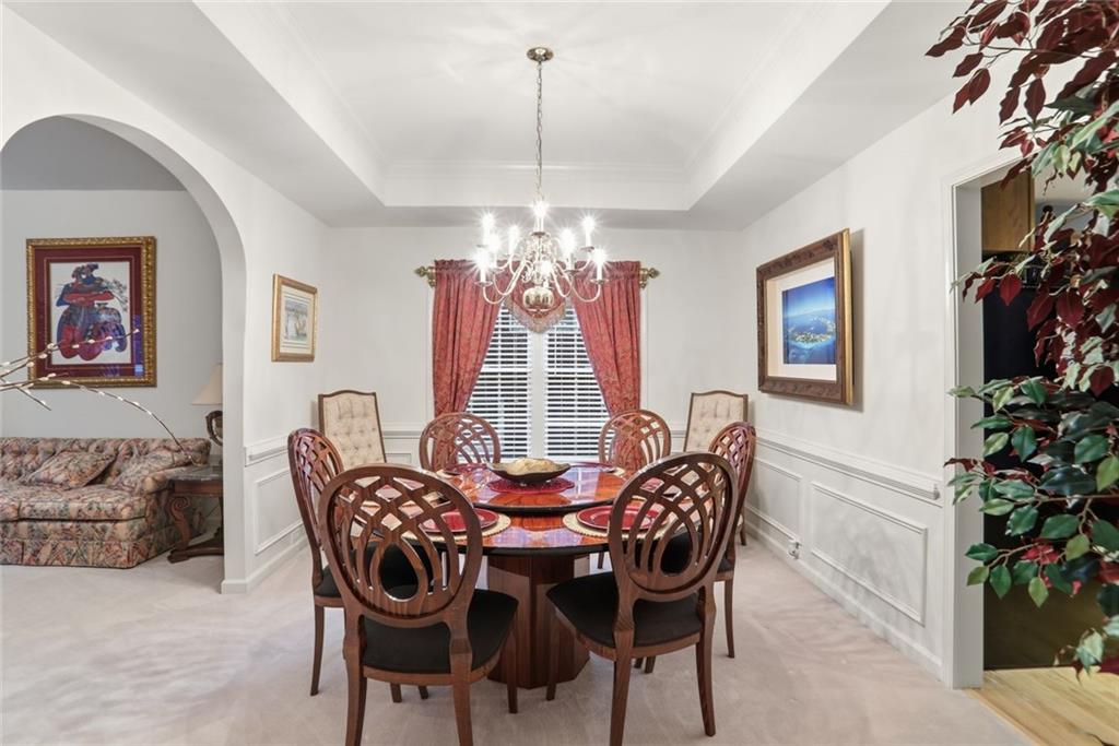 632 Grande View Stone Mountain, GA 30087 - Photo 6 of 46 a view of a dining room with furniture and chandelier