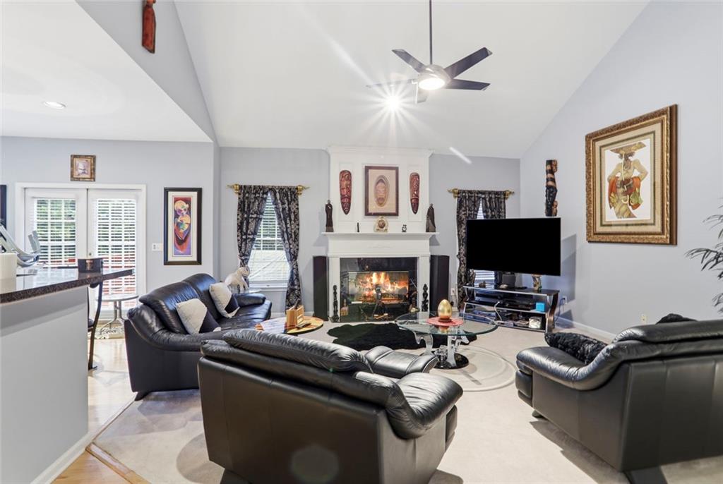 632 Grande View Stone Mountain, GA 30087 - Photo 7 of 46 a living room with furniture or couch and a flat screen tv