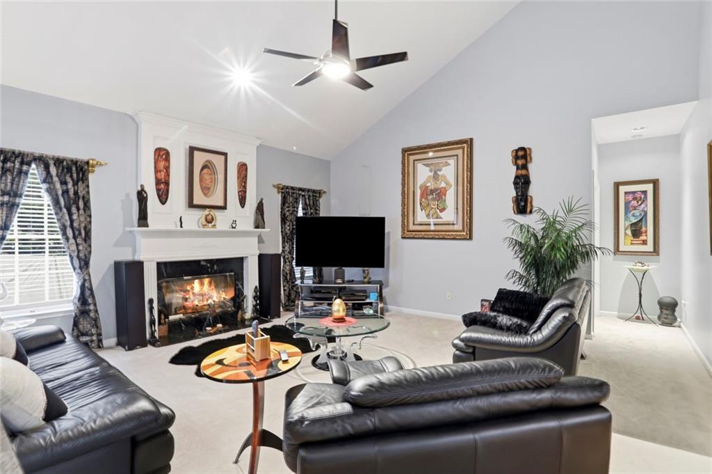 632 Grande View Stone Mountain, GA 30087 - Photo 8 of 46 a living room with furniture and a fireplace