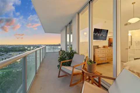 a view of balcony with furniture