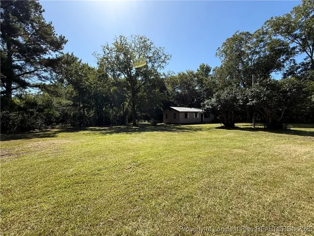 a view of a swimming pool with an outdoor space and seating area