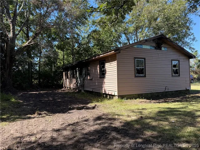 a view of a house with a tree
