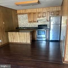 21628 Great Mills Road, Unit A2 Lexington Park, MD 20653 - Photo 5 of 11 a kitchen with granite countertop a refrigerator and a stove