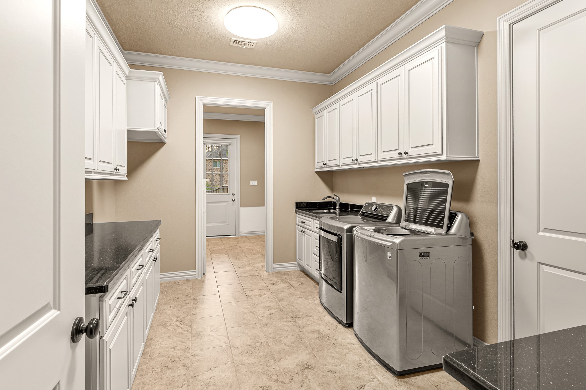 28002 Whispering Maple Way Spring, TX 77386 - Photo 38 of 44 a kitchen with cabinets appliances and a window