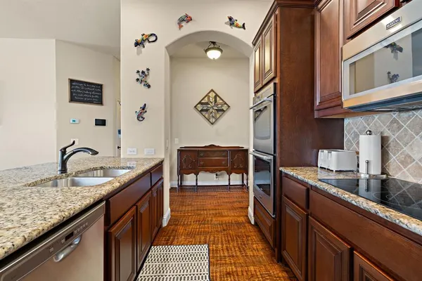 a kitchen with sink cabinets and stove