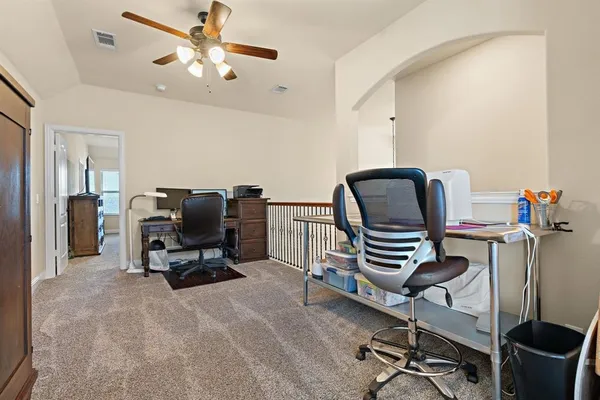 a work room with furniture and gym equipment