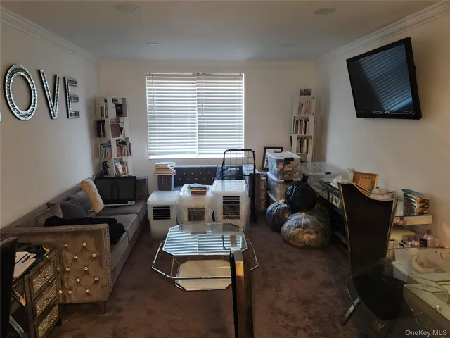 a view of a workspace with furniture and a mirror