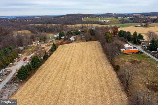 an aerial view of a house with a lake view