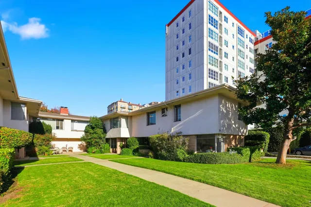 a view of a building with a yard
