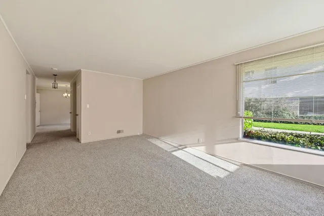 a view of a room with large windows