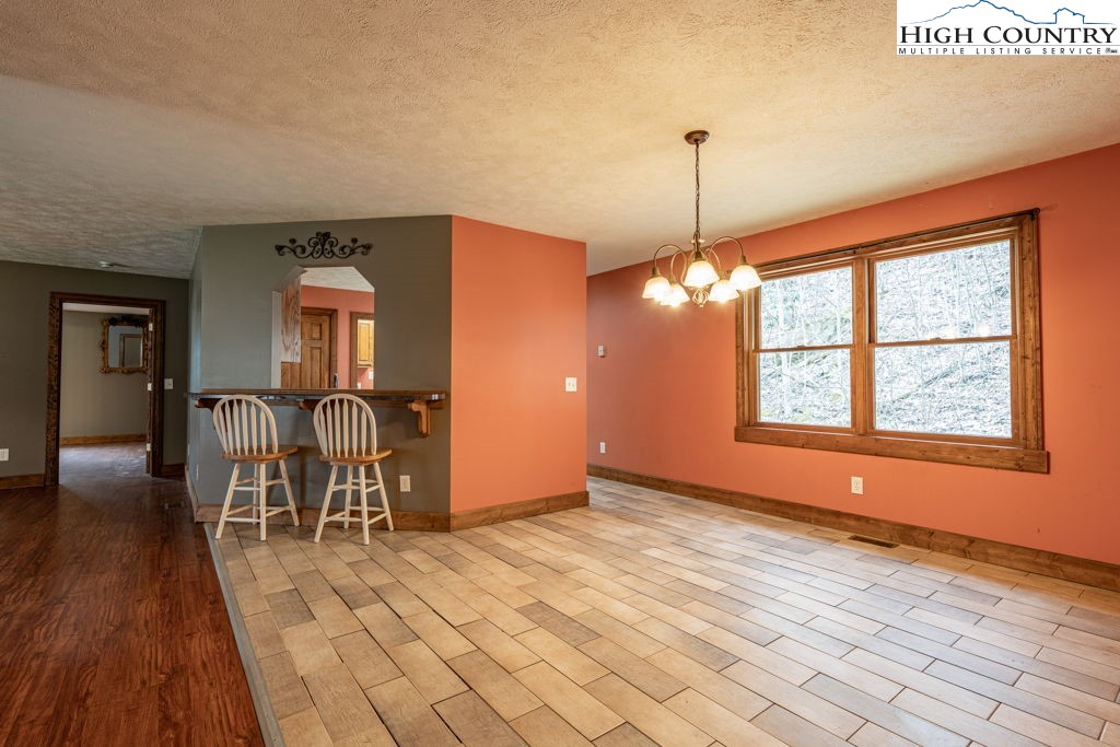 621 Trivette Hollow Road Creston, NC 28615 - Photo 13 of 43 a view of a livingroom with furniture window and wooden floor