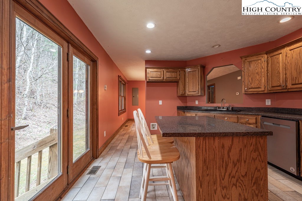 621 Trivette Hollow Road Creston, NC 28615 - Photo 16 of 43 a view of entryway and kitchen with wooden floor