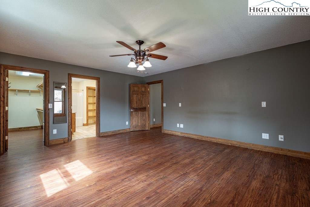 621 Trivette Hollow Road Creston, NC 28615 - Photo 21 of 43 wooden floor in an empty room with a window