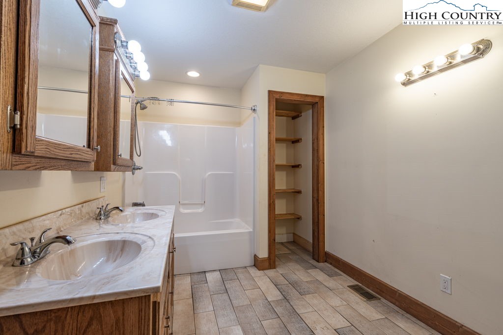 621 Trivette Hollow Road Creston, NC 28615 - Photo 24 of 43 a bathroom with a sink and a mirror