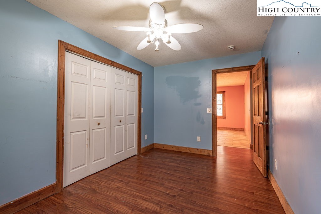 621 Trivette Hollow Road Creston, NC 28615 - Photo 28 of 43 a view of empty room with wooden floor and fan