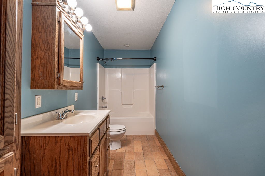 621 Trivette Hollow Road Creston, NC 28615 - Photo 29 of 43 a bathroom with a sink and a mirror