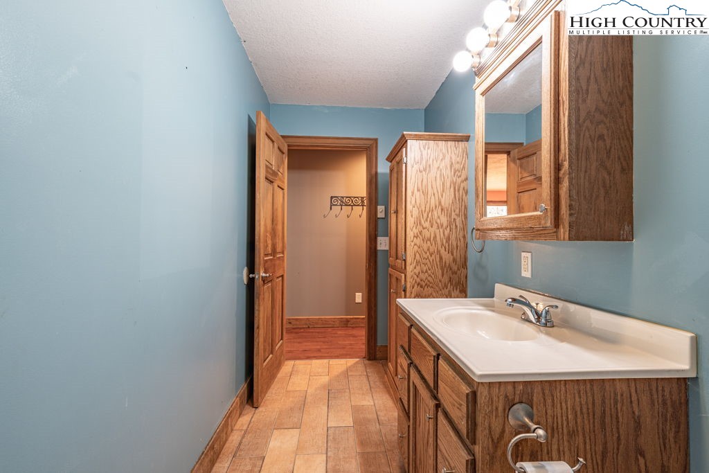 621 Trivette Hollow Road Creston, NC 28615 - Photo 30 of 43 a bathroom with a sink and a mirror