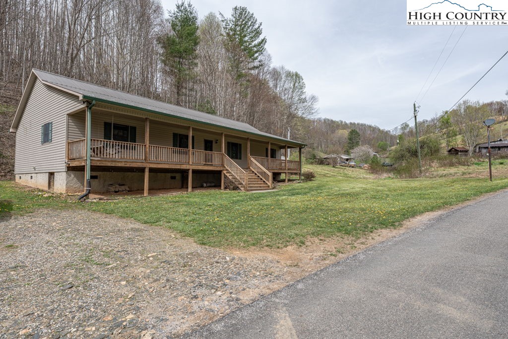 621 Trivette Hollow Road Creston, NC 28615 - Photo 3 of 43 a view of a house with a yard