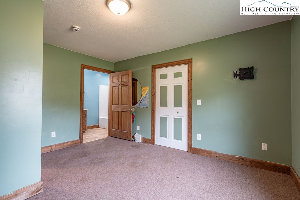 621 Trivette Hollow Road Creston, NC 28615 - Photo 34 of 43 a view of empty room with floor to ceiling window