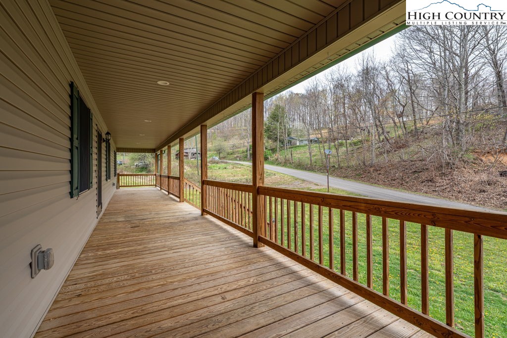 621 Trivette Hollow Road Creston, NC 28615 - Photo 6 of 43 a view of balcony with wooden floor