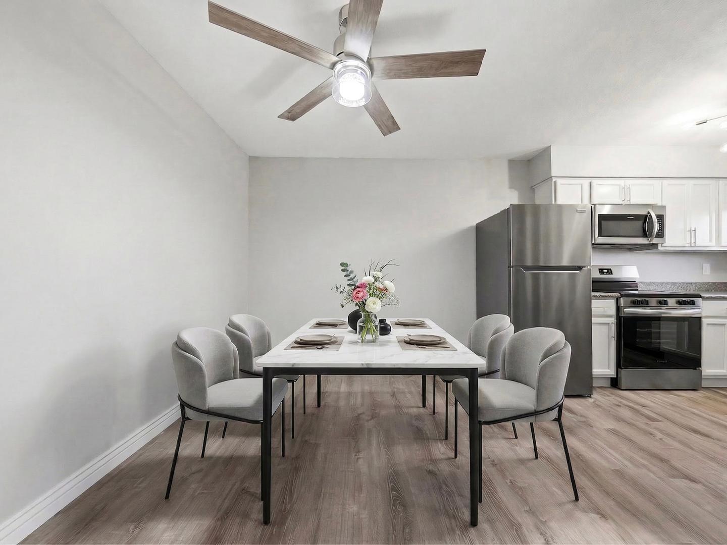 127 South Outpost Road, Unit 4 Apache Junction, AZ 85119 - Photo 12 of 13 a view of a dining room with furniture and wooden floor