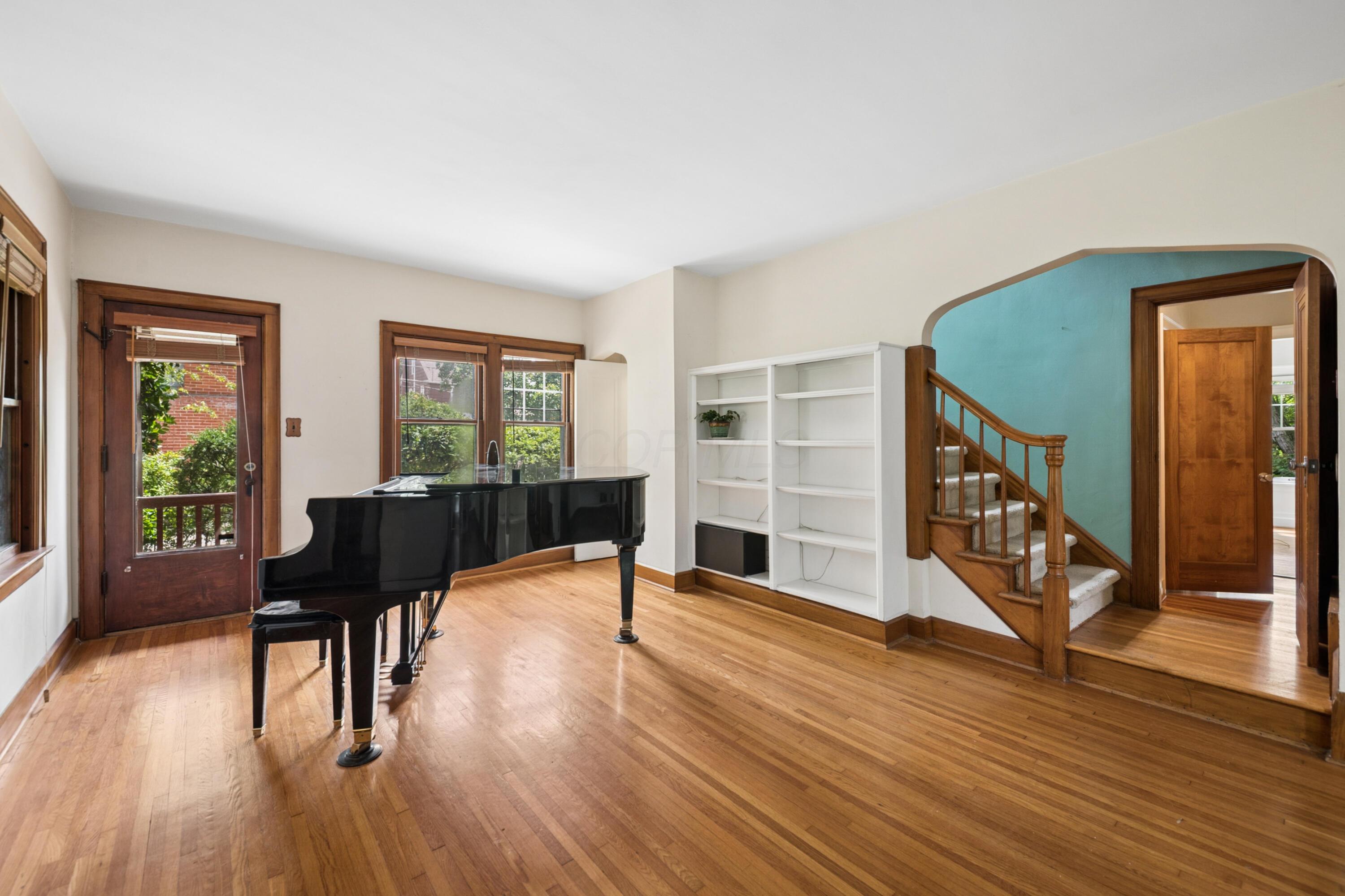 393 Mimring Road Columbus, OH 43202 - Photo 16 of 55 Expansive living room, entry with view to stairs, kitchen access, and side porch access