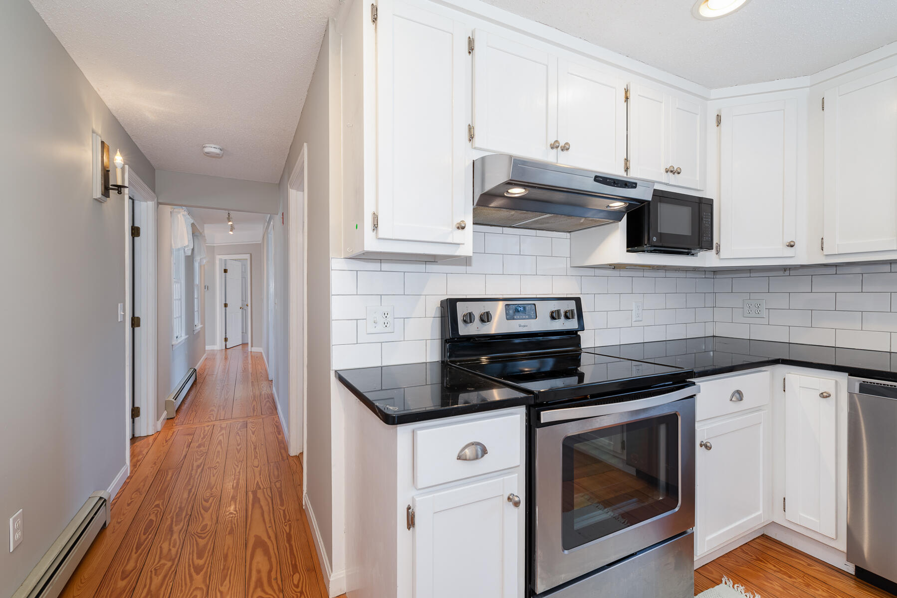 11 Pleasant View Drive Orleans, MA 02653 - Photo 16 of 47 a kitchen with stainless steel appliances a stove a sink and white cabinets