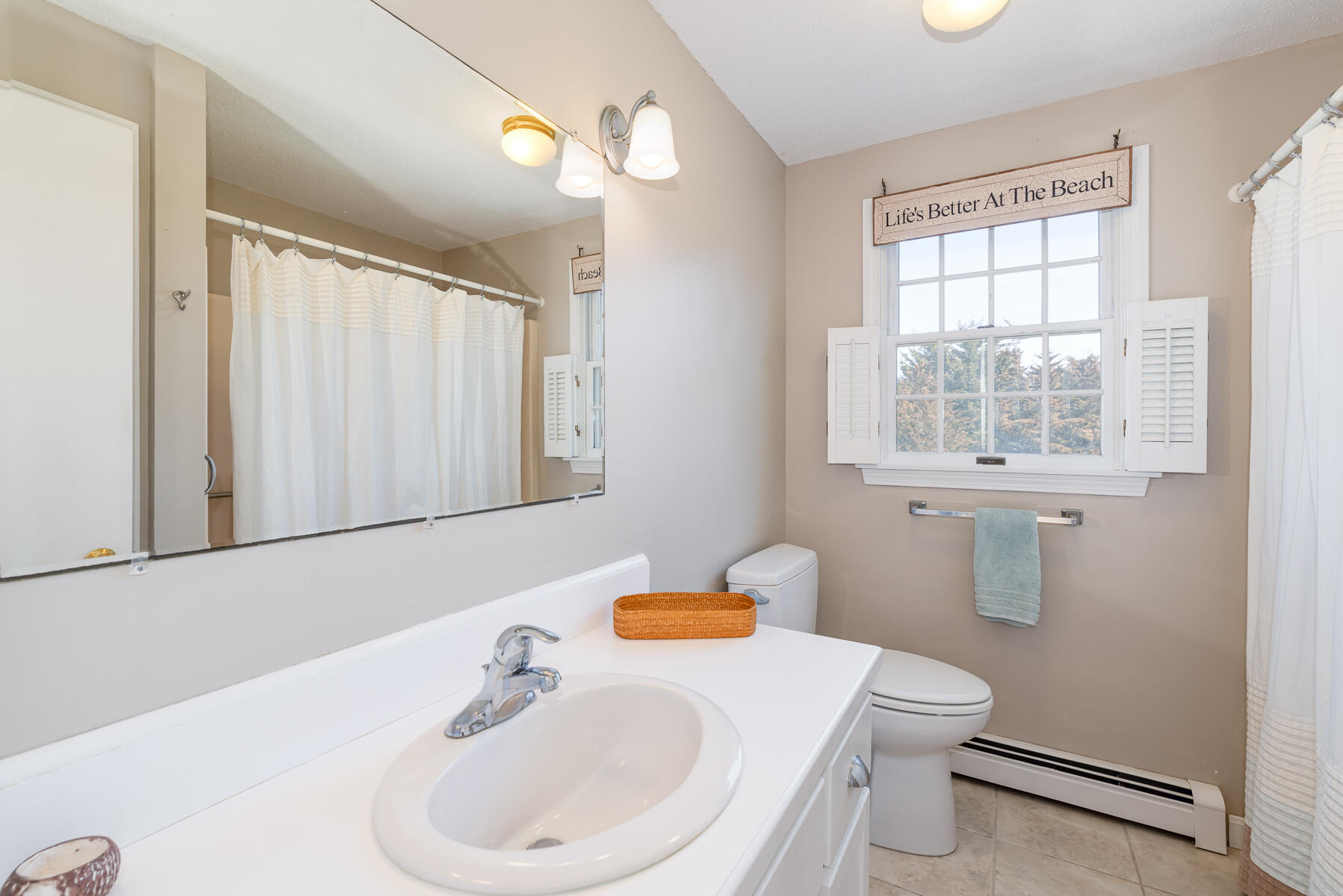 11 Pleasant View Drive Orleans, MA 02653 - Photo 30 of 47 a bathroom with a sink a toilet and a mirror