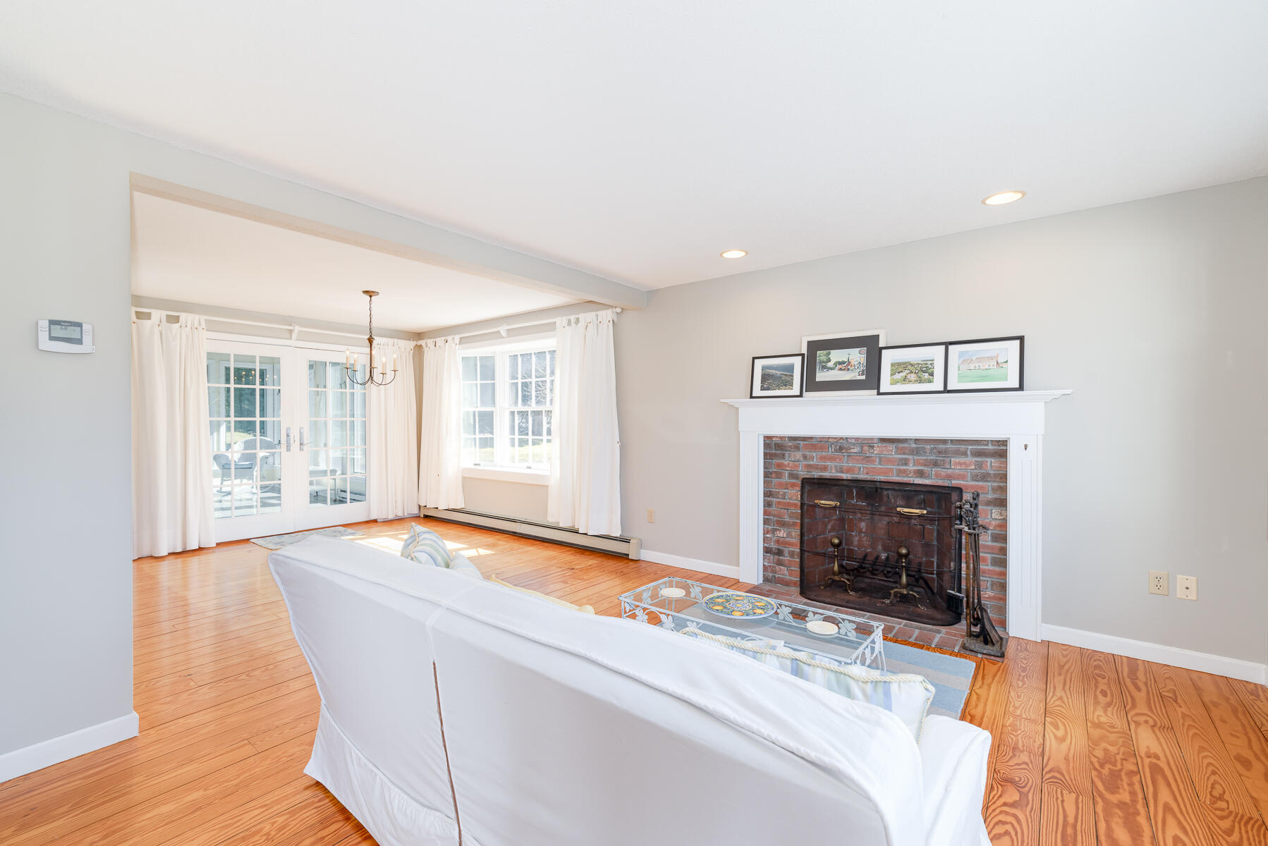 11 Pleasant View Drive Orleans, MA 02653 - Photo 8 of 47 a living room with furniture and a fireplace