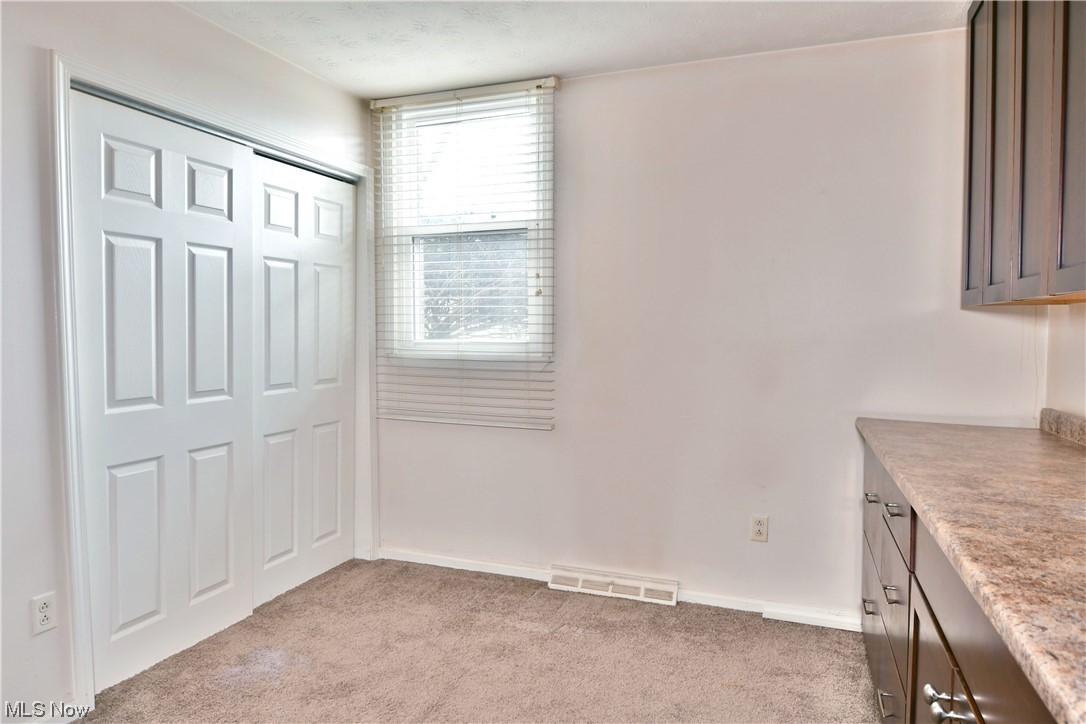 2980 North River Road Northeast, Unit E3 Warren, OH 44483 - Photo 17 of 27 Second bedroom with cabinetry