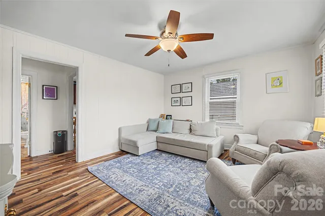 a living room with furniture and a rug