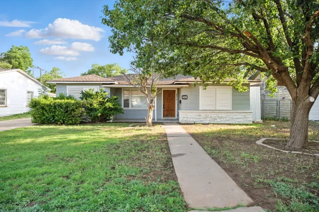 front view of a house with a yard