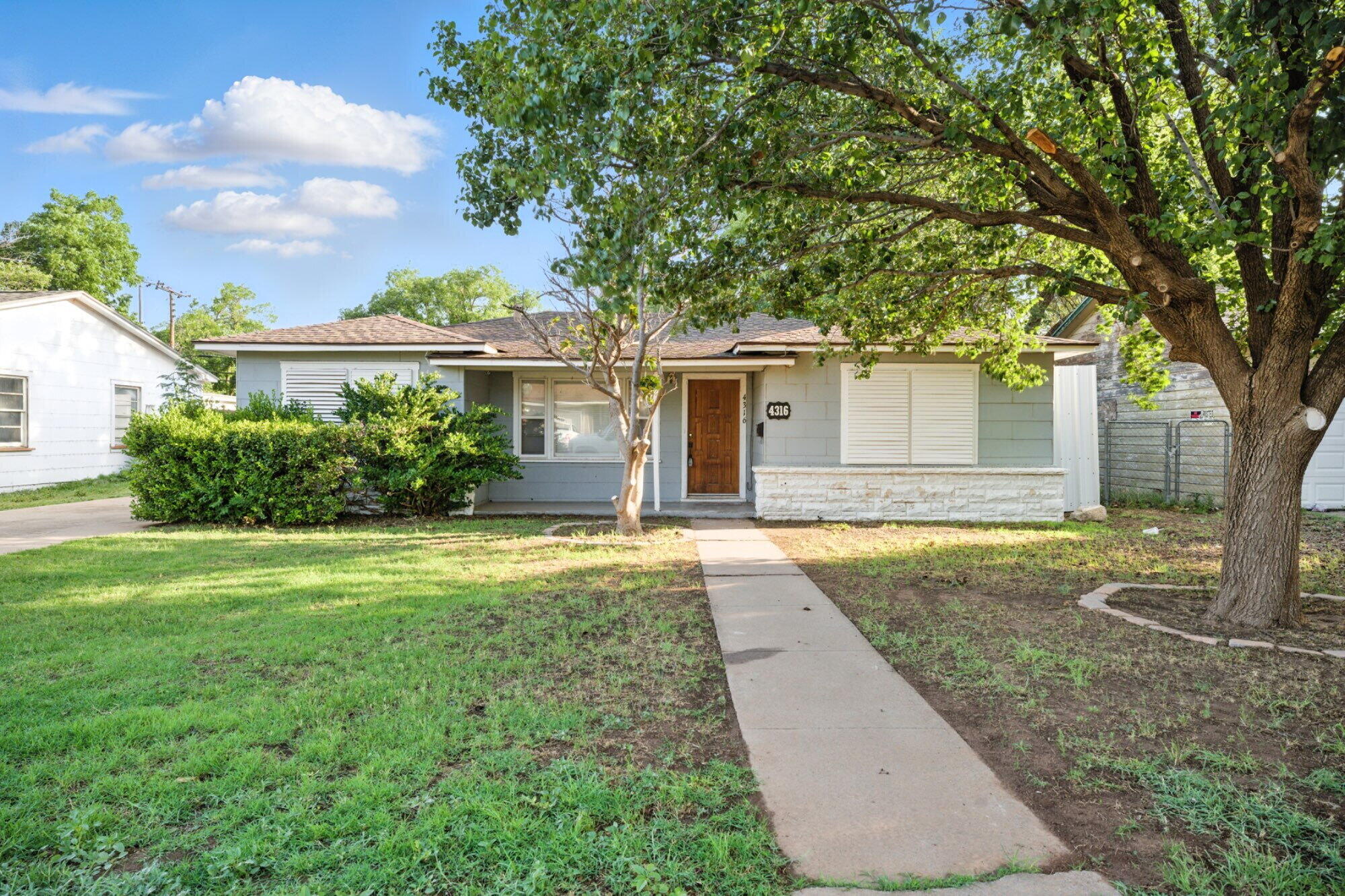front view of a house with a yard