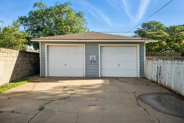 a front view of a house with a garage