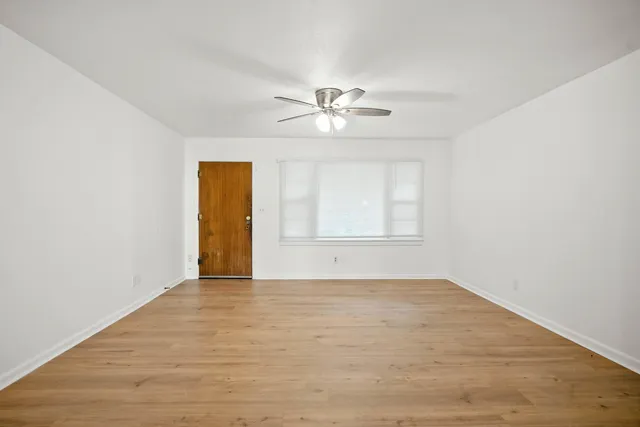 a view of an empty room with a window